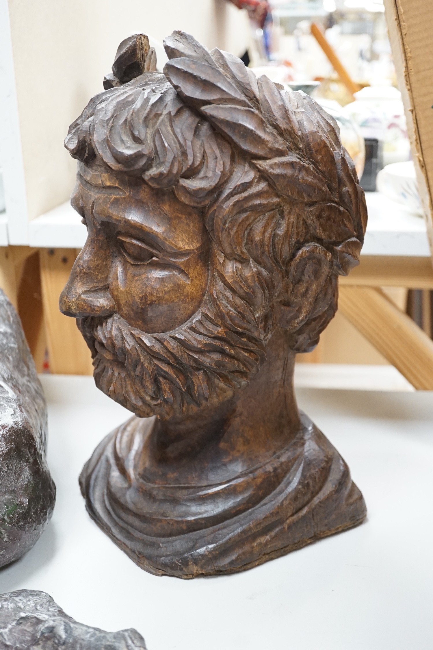 A carved walnut bust of a Roman emperor, 36cm